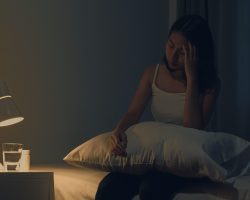 beautiful-asian-young-woman-sitting-bed-take-sleeping-pill-night-medicine-bedroom-unhealthy-sick-indian-female-suffers-from-insomnia-headache-depressed-girl-holds-antidepressant-meds (1)